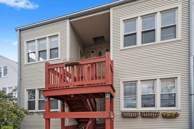 rear view of house featuring a deck