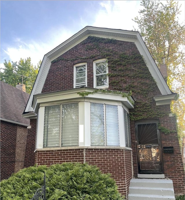1636 N Central Ave, Chicago, IL 60639 - view of front facade featuring a gambrel roof and brick siding