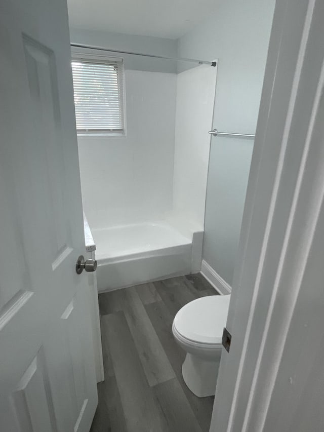 1636 N Central Ave, Chicago, IL 60639 - bathroom featuring toilet, wood finished floors, and bathing tub / shower combination