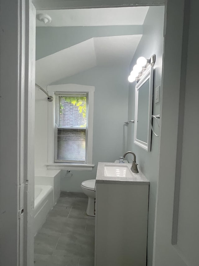 1636 N Central Ave, Chicago, IL 60639 - full bath featuring vanity, toilet, lofted ceiling, and washtub / shower combination