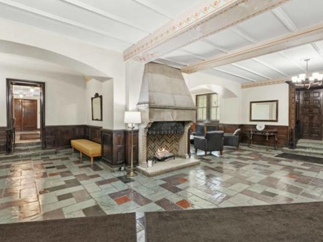 7321 S S Shore Dr Unit 11-B, Chicago, IL 60649 - lobby with wainscoting and beamed ceiling