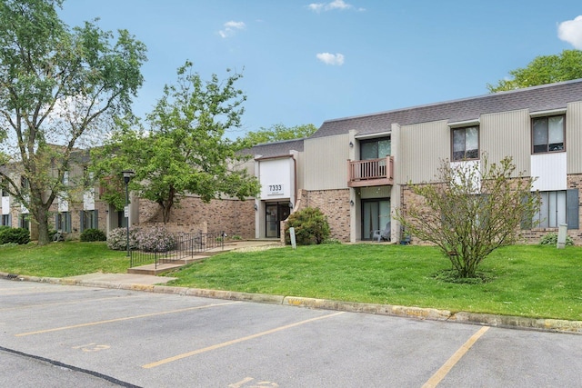 7333 Grand Ave Unit 102, Downers Grove, IL 60516 - view of property featuring uncovered parking
