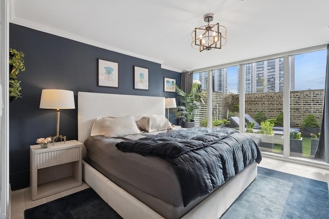 1516 N State Pkwy Unit 5D, Chicago, IL 60610 - bedroom featuring ornamental molding, access to outside, wood finished floors, a chandelier, and expansive windows