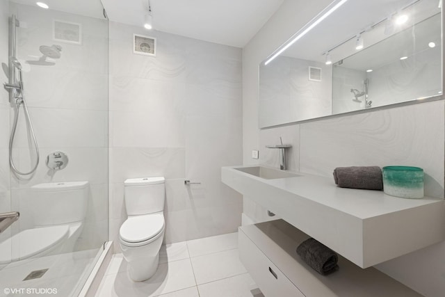 1516 N State Pkwy Unit 5D, Chicago, IL 60610 - full bath featuring rail lighting, toilet, tile walls, and a shower
