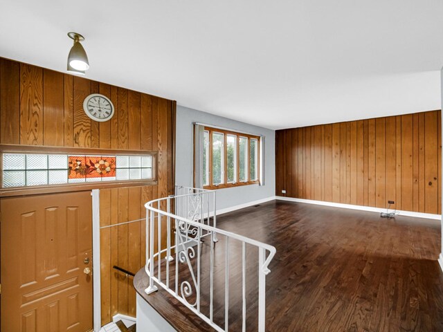 9040 Meadowview Dr, Hickory Hills, IL 60457 - entrance foyer featuring wood walls, wood finished floors, and baseboards
