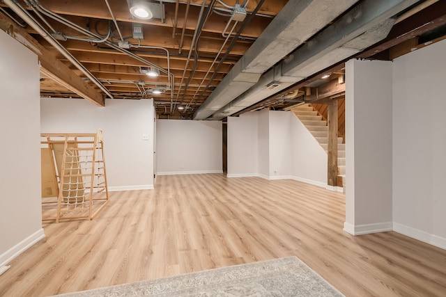 16 Lucas Dr, Palos Hills, IL 60465 - finished basement featuring wood finished floors, stairs, and baseboards