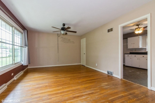 170 Wallace St, New Lenox, IL 60451 - empty room with ceiling fan, light wood-style floors, and baseboards