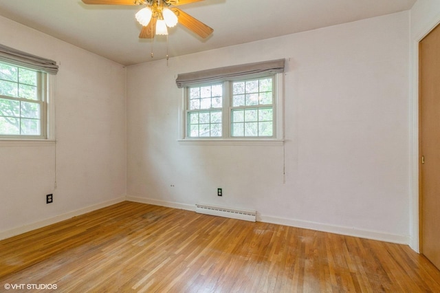 170 Wallace St, New Lenox, IL 60451 - spare room featuring a baseboard heating unit, light wood-style floors, baseboards, and a ceiling fan
