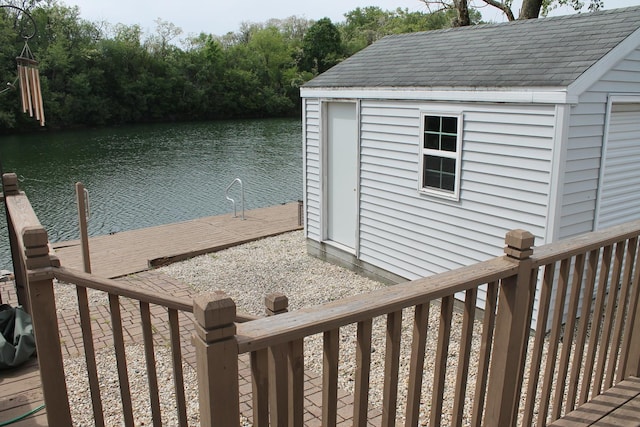 wooden terrace with a water view and a dock