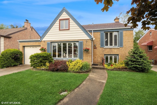 273 Desplaines Ave, Riverside, IL 60546 - tudor-style house with driveway, an attached garage, brick siding, a front lawn, and a chimney