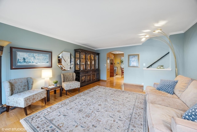 273 Desplaines Ave, Riverside, IL 60546 - living room with ornamental molding, arched walkways, and wood finished floors