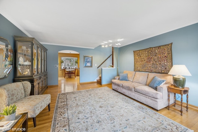 273 Desplaines Ave, Riverside, IL 60546 - living area with crown molding, stairs, light wood-style floors, arched walkways, and baseboards