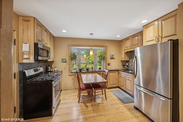 273 Desplaines Ave, Riverside, IL 60546 - kitchen featuring stainless steel appliances, light wood finished floors, decorative backsplash, recessed lighting, and pendant lighting