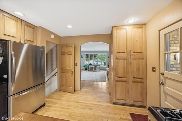 273 Desplaines Ave, Riverside, IL 60546 - kitchen featuring freestanding refrigerator, arched walkways, light wood-type flooring, recessed lighting, and range with gas stovetop