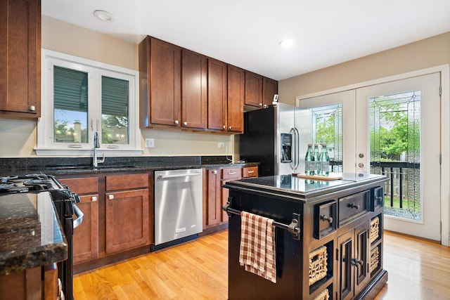 1000 S Ahrens Ave, Lombard, IL 60148 - kitchen featuring stainless steel appliances, light wood-style floors, dark stone counters, recessed lighting, and french doors