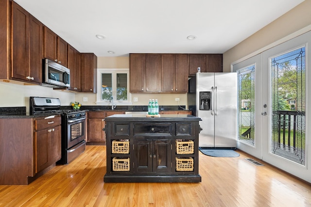 1000 S Ahrens Ave, Lombard, IL 60148 - kitchen featuring appliances with stainless steel finishes, light wood-style floors, dark brown cabinetry, and recessed lighting