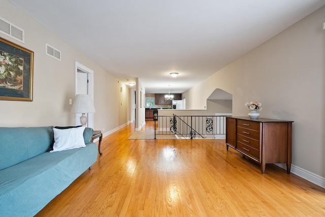 1000 S Ahrens Ave, Lombard, IL 60148 - living room with light wood-style flooring and a chandelier