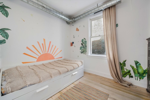 3306 W Lemoyne St, Chicago, IL 60651 - bedroom with light wood-style floors and baseboards