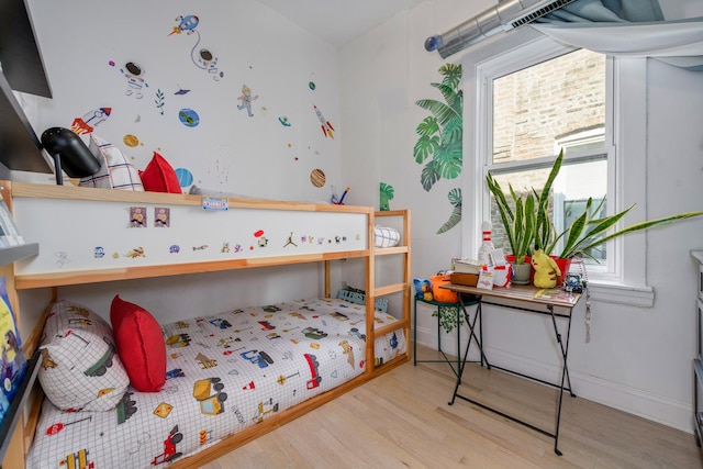 3306 W Lemoyne St, Chicago, IL 60651 - bedroom featuring wood finished floors, multiple windows, and baseboards