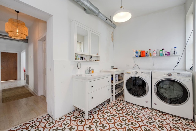 3306 W Lemoyne St, Chicago, IL 60651 - washroom with washer and clothes dryer and light wood finished floors