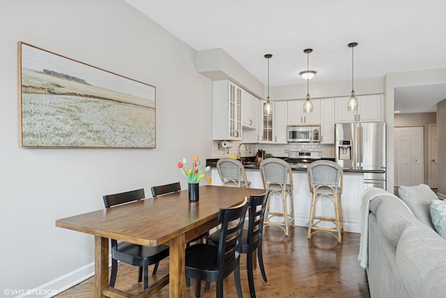 2523 N Halsted St Unit 2, Chicago, IL 60614 - dining space featuring dark wood-style floors and baseboards