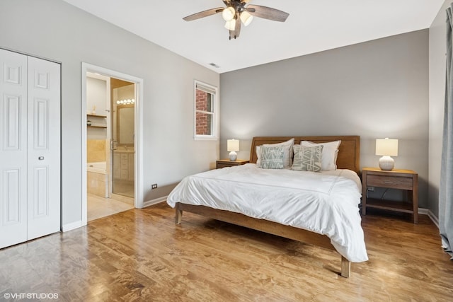 2523 N Halsted St Unit 2, Chicago, IL 60614 - bedroom featuring baseboards, wood finished floors, ensuite bath, and ceiling fan