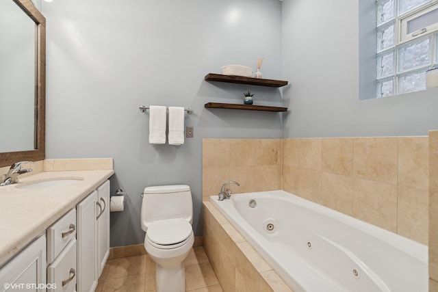 2523 N Halsted St Unit 2, Chicago, IL 60614 - full bathroom with toilet, a tub with jets, vanity, tile patterned floors, and baseboards