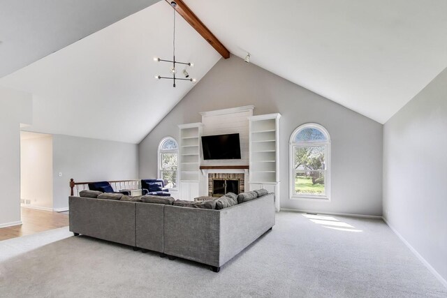 2481 Benton St, Palatine, IL 60067 - living area featuring carpet flooring, baseboards, a brick fireplace, and a chandelier