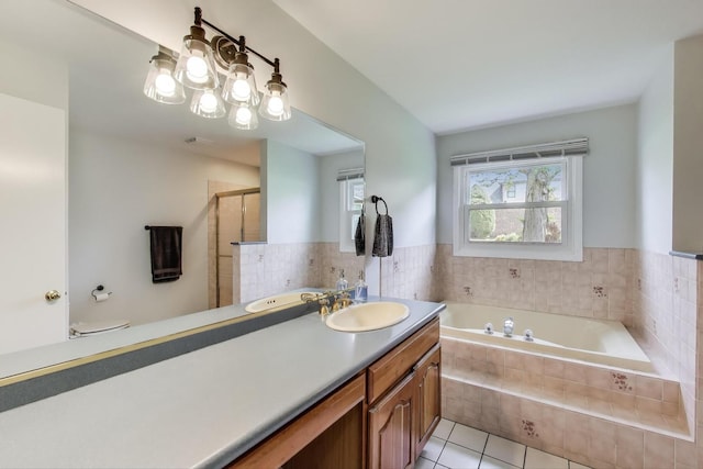 2481 Benton St, Palatine, IL 60067 - bathroom with tile patterned flooring, a bath, a shower stall, and vanity