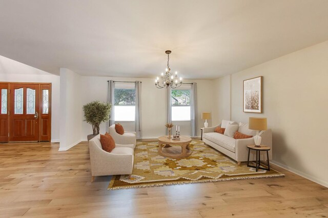 2481 Benton St, Palatine, IL 60067 - living room featuring a chandelier, wood finished floors, and baseboards