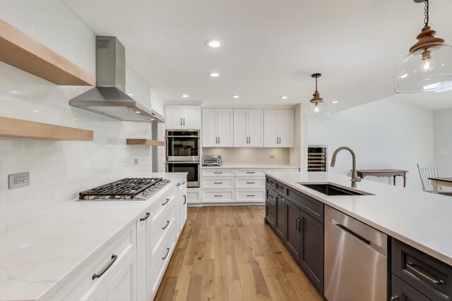 2481 Benton St, Palatine, IL 60067 - kitchen featuring stainless steel appliances, a sink, open shelves, range hood, and white cabinetry