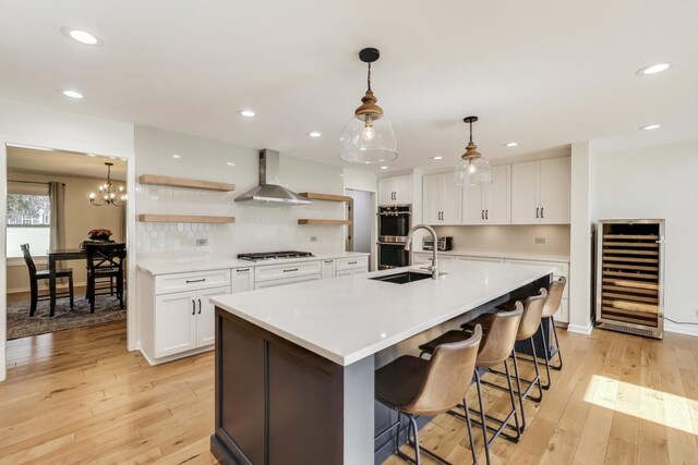 2481 Benton St, Palatine, IL 60067 - kitchen featuring wine cooler, wall chimney range hood, stainless steel appliances, open shelves, and white cabinetry