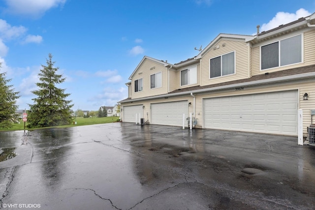 39674 N Warren Ln Unit 0, Beach Park, IL 60083 - view of front facade featuring driveway and a garage
