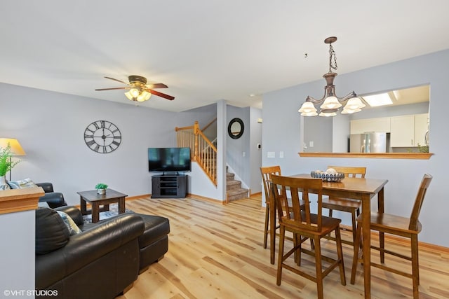 39674 N Warren Ln Unit 0, Beach Park, IL 60083 - dining area with stairs, light wood-type flooring, a chandelier, and ceiling fan