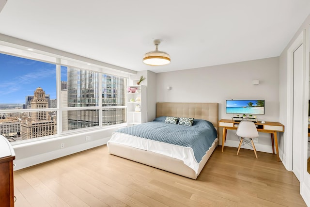 405 N Wabash Ave Unit 4308, Chicago, IL 60611 - bedroom with wood finished floors and a view of city