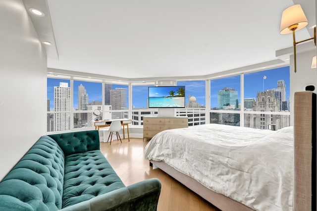 405 N Wabash Ave Unit 4308, Chicago, IL 60611 - bedroom featuring wood finished floors, floor to ceiling windows, multiple windows, and recessed lighting