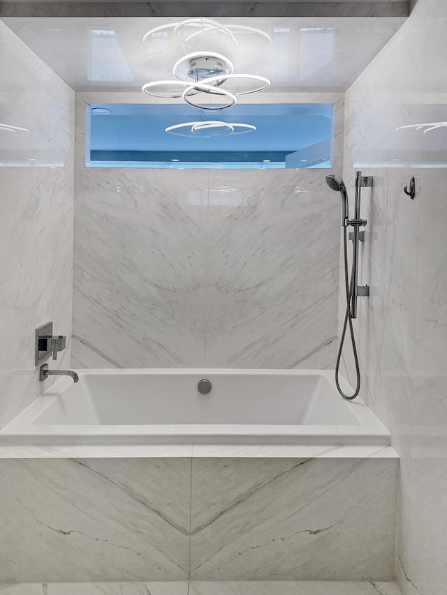 405 N Wabash Ave Unit 4308, Chicago, IL 60611 - bathroom featuring a combined bath / shower with marble appearance and a chandelier