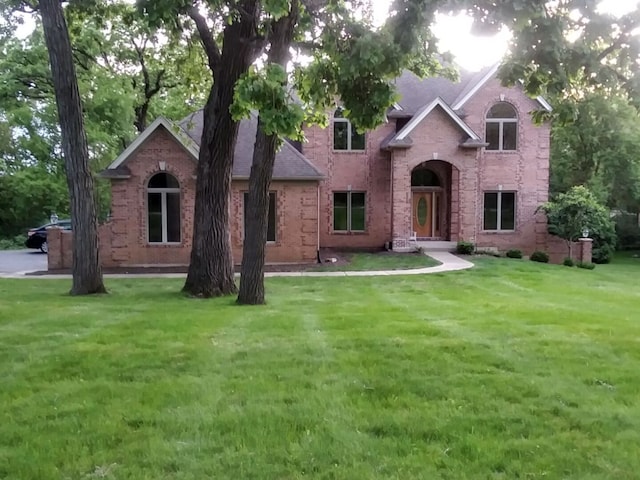 4301 Hickory Hill Ct, Johnsburg, IL 60051 - traditional-style home with a front yard and brick siding