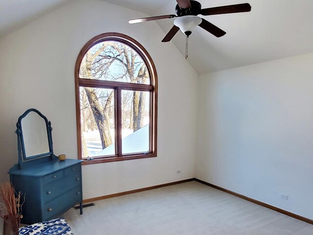 4301 Hickory Hill Ct, Johnsburg, IL 60051 - unfurnished bedroom with multiple windows, vaulted ceiling, baseboards, and ceiling fan