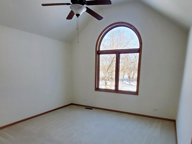 4301 Hickory Hill Ct, Johnsburg, IL 60051 - spare room with light colored carpet, ceiling fan, vaulted ceiling, and baseboards