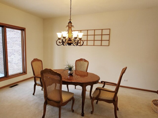 4301 Hickory Hill Ct, Johnsburg, IL 60051 - dining area with a chandelier, healthy amount of natural light, and light carpet