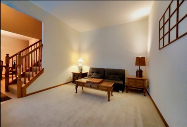 4301 Hickory Hill Ct, Johnsburg, IL 60051 - carpeted living area featuring baseboards and stairs