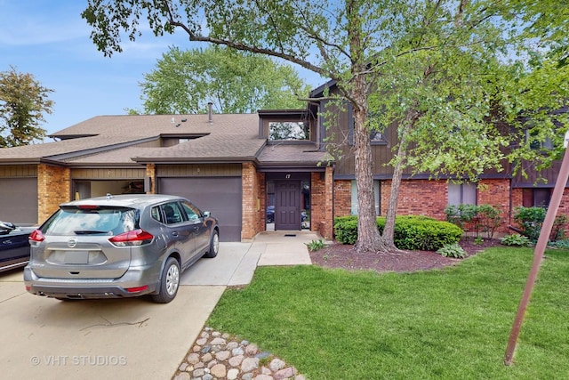 17 Creekside Cir N Unit D, Elgin, IL 60123 - view of front of home featuring brick siding, concrete driveway, a garage, and a front lawn