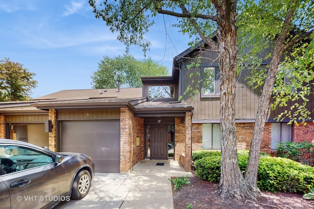 17 Creekside Cir N Unit D, Elgin, IL 60123 - view of front of house with a garage, concrete driveway, and brick siding