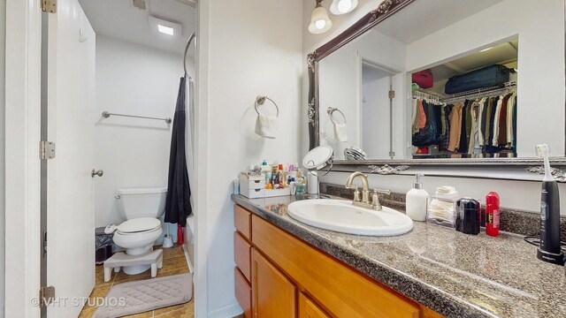 17 Creekside Cir N Unit D, Elgin, IL 60123 - bathroom with vanity, toilet, tile patterned flooring, and a walk in closet