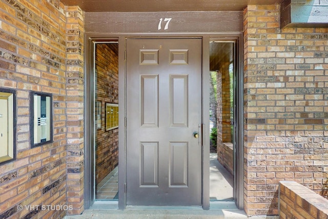 17 Creekside Cir N Unit D, Elgin, IL 60123 - doorway to property featuring brick siding