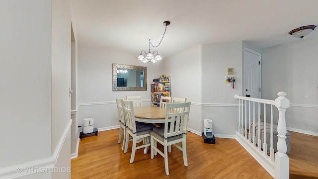 17 Creekside Cir N Unit D, Elgin, IL 60123 - dining space featuring a chandelier, light wood-style floors, and baseboards