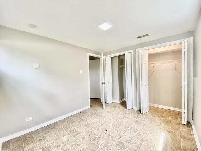 332 Gentry St, Park Forest, IL 60466 - unfurnished bedroom featuring multiple closets and baseboards