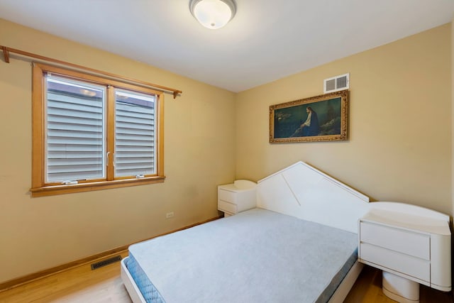 6856 W Montrose Ave, Harwood Heights, IL 60706 - bedroom with wood finished floors and baseboards