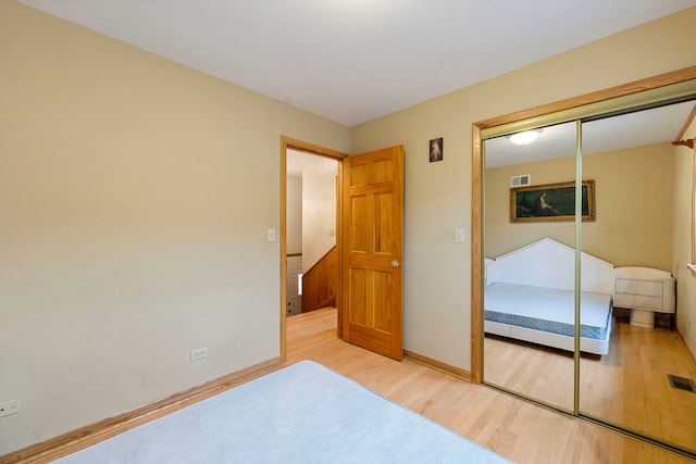 6856 W Montrose Ave, Harwood Heights, IL 60706 - bedroom with wood finished floors and a closet